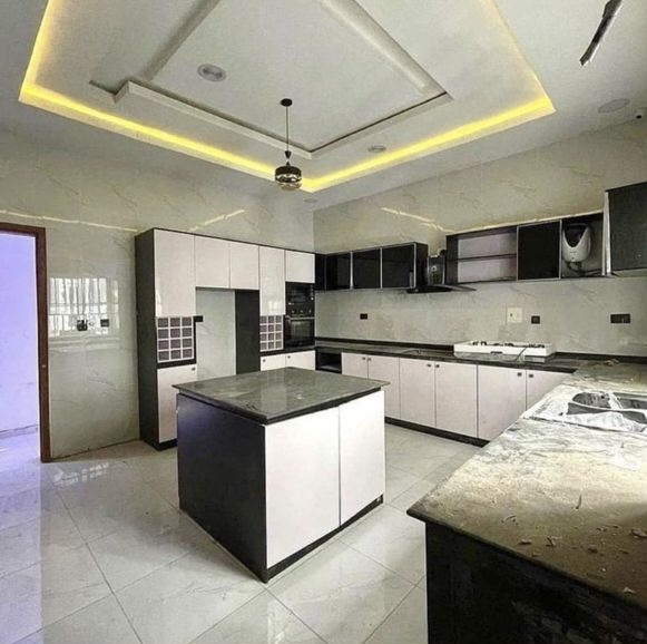 Fitted open kitchen with island in a Jaykinga Vision Realty listing